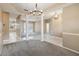 Spacious living room with decorative columns and tile flooring flowing to a pool view through the sliding glass doors at 3808 Ocita Dr, Orlando, FL 32837