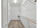 Walk-in closet with carpet flooring and metal shelving on all sides for maximum storage at 3808 Ocita Dr, Orlando, FL 32837