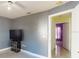 Bedroom with a TV and a glimpse into the hallway at 3917 Derby Dr, Lakeland, FL 33809
