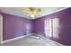 Bedroom featuring purple walls and a ceiling fan at 3917 Derby Dr, Lakeland, FL 33809
