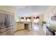 Kitchen with stainless steel appliances and living area in background at 3917 Derby Dr, Lakeland, FL 33809