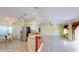 Open kitchen and living area with stainless steel appliances and tiled flooring at 3917 Derby Dr, Lakeland, FL 33809