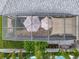 Aerial view of screened-in lanai featuring outdoor furniture, garden, and access to the swimming pool area at 4545 Fox St, Orlando, FL 32814