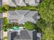 The house's aerial view reveals the layout, pool, screened-in porch, and general aesthetics at 4545 Fox St, Orlando, FL 32814