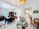 The Foyer leads into an open-concept dining room featuring elegant furnishings and contemporary decor at 4545 Fox St, Orlando, FL 32814