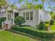Attractive home featuring manicured hedges and landscaping, enhancing its curb appeal under a clear blue sky at 4545 Fox St, Orlando, FL 32814