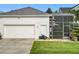 A spacious two-car garage is attached to this home and gives access to the screen patio at 4545 Fox St, Orlando, FL 32814