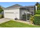 A spacious two-car garage is attached to this home and gives access to the screen patio at 4545 Fox St, Orlando, FL 32814
