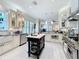 Beautiful kitchen with a center island, modern appliances, and an open layout to the living room at 4545 Fox St, Orlando, FL 32814