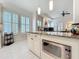 Open kitchen design boasts an island and a large window for abundant natural light at 4545 Fox St, Orlando, FL 32814