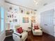 Cozy living room featuring dark floors, built in shelves and comfortable seating at 4545 Fox St, Orlando, FL 32814