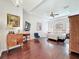 Luxurious main bedroom with hardwood floors, tray ceilings, and a chandelier at 4545 Fox St, Orlando, FL 32814
