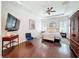 Elegant main bedroom with hardwood floors, tray ceiling, and natural light at 4545 Fox St, Orlando, FL 32814