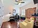 Office with wood floors, brick accent wall, ceiling fan and a desk perfect for working from home at 4545 Fox St, Orlando, FL 32814