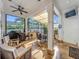 Enclosed patio features an outdoor kitchen, seating, and a ceiling fan at 4545 Fox St, Orlando, FL 32814