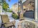 Relaxing outdoor patio area with a stylish fire pit, comfortable seating, and a serene ambiance at 4545 Fox St, Orlando, FL 32814