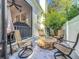Inviting patio featuring a stone fire pit and comfortable seating, perfect for outdoor relaxation and entertaining guests at 4545 Fox St, Orlando, FL 32814