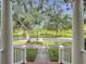 Scenic view from the front porch showcasing lush landscaping and a peaceful street lined with mature trees at 4545 Fox St, Orlando, FL 32814