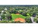 An aerial view of the neighborhood baseball fields, with lush trees providing ample shade, perfect for outdoor activities at 501 Richmond St, Orlando, FL 32806