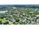 An aerial view showcasing a neighborhood with lush trees, highlighting the property's prime location and community charm at 501 Richmond St, Orlando, FL 32806