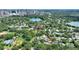 Stunning aerial view of neighborhood with mature trees, nearby lake and cityscape at 501 Richmond St, Orlando, FL 32806