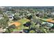 Beautiful aerial view of community featuring a baseball field, walking paths, and lush greenery at 501 Richmond St, Orlando, FL 32806