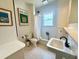 Well-lit bathroom features a shower and sink at 501 Richmond St, Orlando, FL 32806