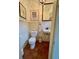 Cozy powder room with wainscoting, stylish decor, and unique fixtures at 501 Richmond St, Orlando, FL 32806