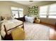 Cozy bedroom with two beds, stylish decor, and natural light at 501 Richmond St, Orlando, FL 32806