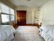 Spacious bedroom features two beds, a large rug, and ample storage at 501 Richmond St, Orlando, FL 32806