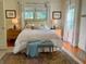 Comfortable bedroom featuring a king bed and two windows at 501 Richmond St, Orlando, FL 32806