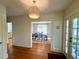 Open-concept layout showcasing the dining room with elegant lighting and seamless flow to the entryway at 501 Richmond St, Orlando, FL 32806