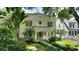 Charming two-story home with a classic design, featuring a well-manicured lawn and mature landscaping at 501 Richmond St, Orlando, FL 32806
