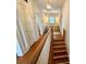 Bright hallway leading to a comfy seating area with natural light and a cozy couch at 501 Richmond St, Orlando, FL 32806