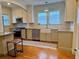 Bright, functional kitchen with stainless steel appliances, granite countertops, and a farmhouse sink at 501 Richmond St, Orlando, FL 32806
