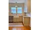 Traditional kitchen with white cabinets, granite countertops, and farmhouse sink at 501 Richmond St, Orlando, FL 32806