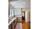 Modern kitchen with white cabinets and a view to the dining room at 501 Richmond St, Orlando, FL 32806