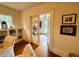 The office features a pair of chairs, built-in bookshelves, hardwood floors, and a view of the outdoors at 501 Richmond St, Orlando, FL 32806
