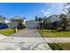 Charming single-Gathering home with a brick driveway and well-maintained front yard at 5029 Grand Teton Ct, Deland, FL 32724