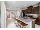 Modern kitchen with granite countertops, stainless steel appliances, and a breakfast bar at 5029 Grand Teton Ct, Deland, FL 32724