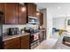 Well-equipped kitchen boasts stainless steel appliances, granite counters, and convenient access to the living area at 5029 Grand Teton Ct, Deland, FL 32724