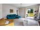 Cozy living room with tile floors, modern furniture, and natural light from sliding glass doors at 5029 Grand Teton Ct, Deland, FL 32724
