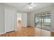 Bedroom with hardwood floors, a ceiling fan, sliding glass doors and a closet at 5334 Cypress Dr, Winter Park, FL 32792