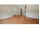 Spacious living room featuring beautiful laminate floors and neutral walls at 5334 Cypress Dr, Winter Park, FL 32792