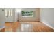 Light-filled living space with laminate floors, large window, and a view of the exterior, offering ample natural light at 5334 Cypress Dr, Winter Park, FL 32792