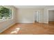Bright and airy living room with laminate flooring and a large window providing ample natural light at 5334 Cypress Dr, Winter Park, FL 32792