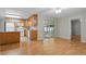 Open-concept living room and kitchen area with sliding glass doors to a patio at 5334 Cypress Dr, Winter Park, FL 32792