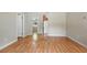 Open-concept living area featuring laminate floors and seamless transition to kitchen and dining spaces at 5334 Cypress Dr, Winter Park, FL 32792
