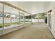 Enclosed patio area perfect for outdoor entertaining, featuring screened windows and access to the backyard at 5334 Cypress Dr, Winter Park, FL 32792