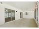 Bright and spacious patio with white walls, sliding glass doors, and stylish lighting at 5334 Cypress Dr, Winter Park, FL 32792